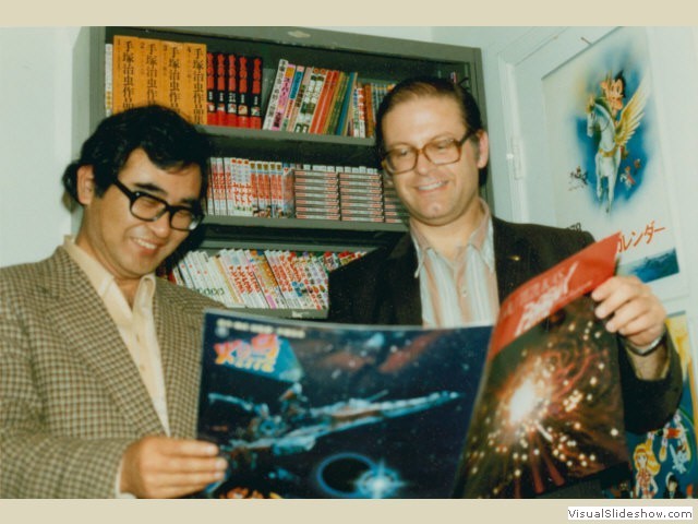 Takaji Kusonoki and Fred Patten look at a pressbook for the animated feature Phoenix 2772, <br/>1980.