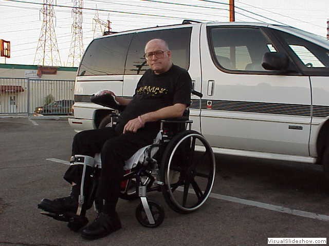 Fred outside by wagon.