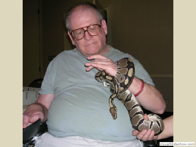 Fred holding Aahz the ball python at CaliFur 2 in 2006.